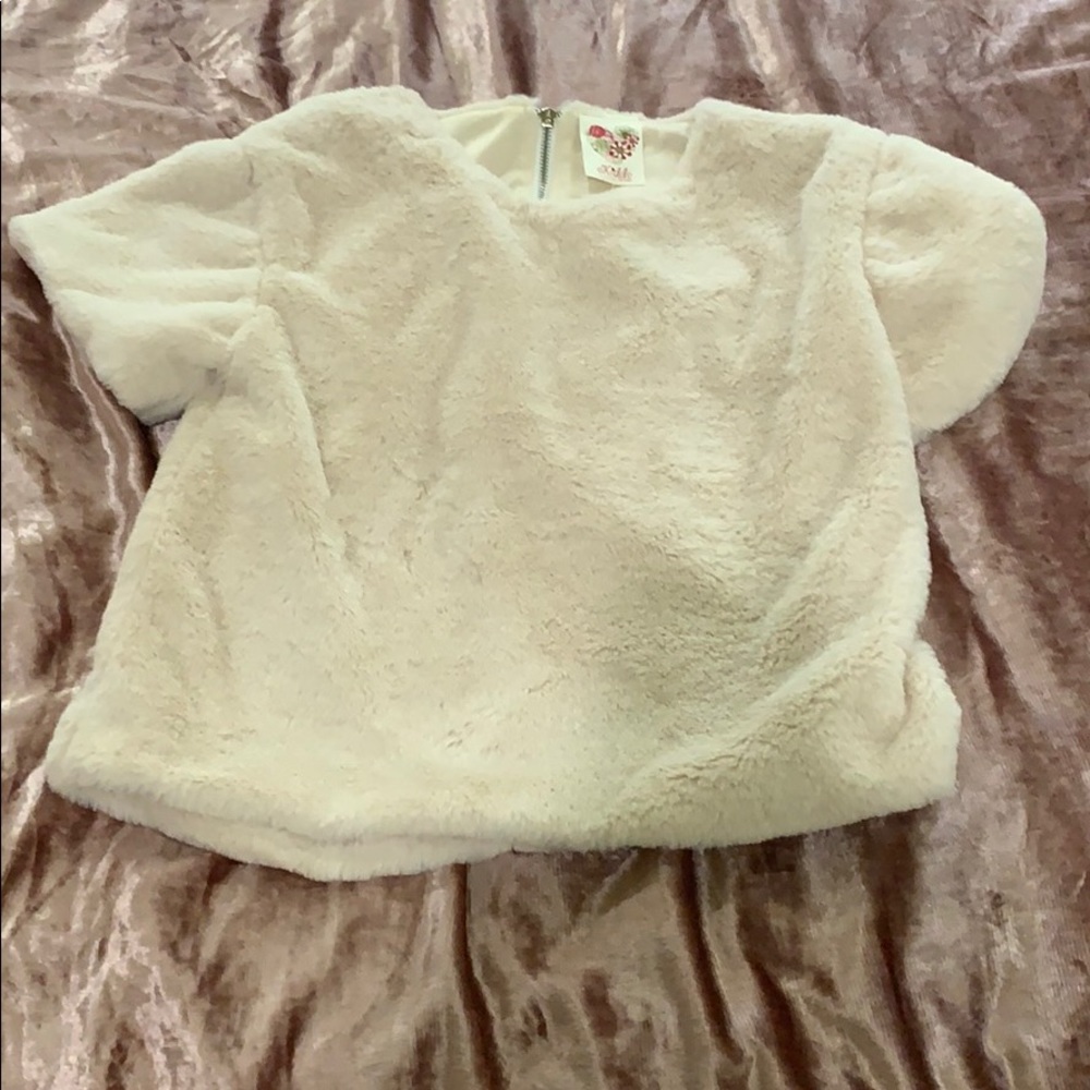 Cute fuzzy top great for nice occasions.